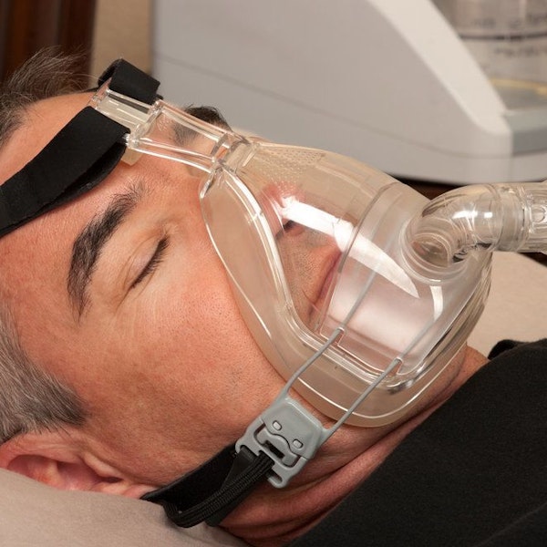 man in cpap device